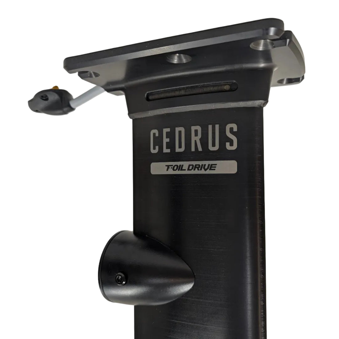 Closeup of the plate board mount and Foil Drive pod of a Cedrus Evolution Aluminum Integrated Assist mast anodized in black from the starboard side showing laser etched logos